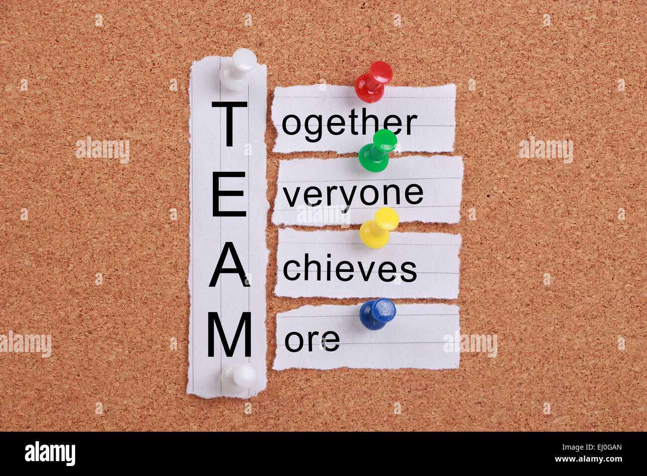 Teamwork concept pinned on a cork board
